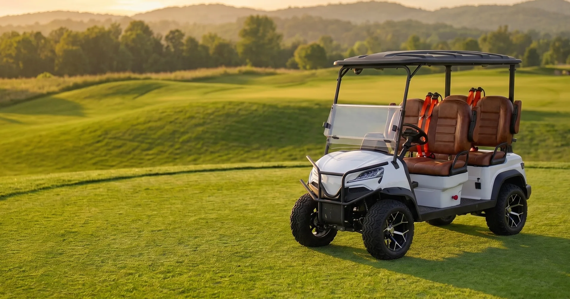 White six-seat electric golf cart on a golf course