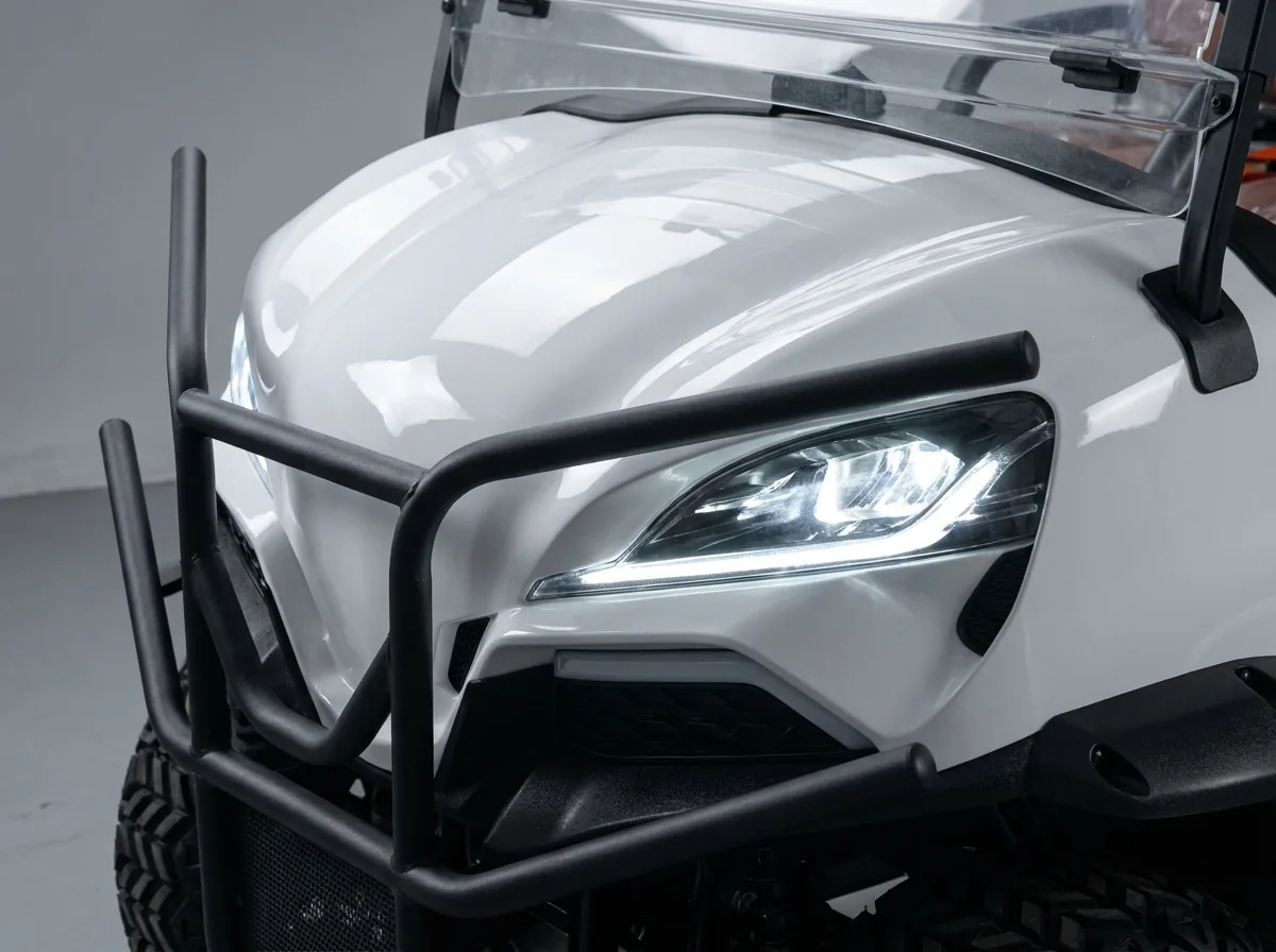 Front-end detail of a white four-seat electric golf cart