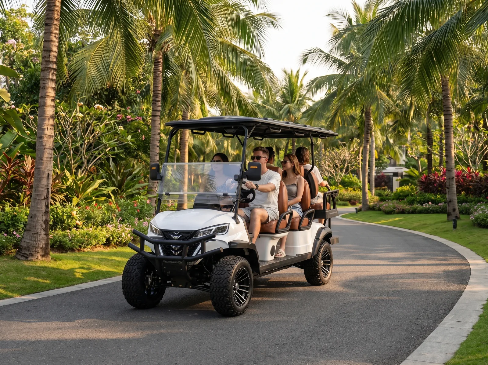White six-seat electric golf cart driving on a tropical property road