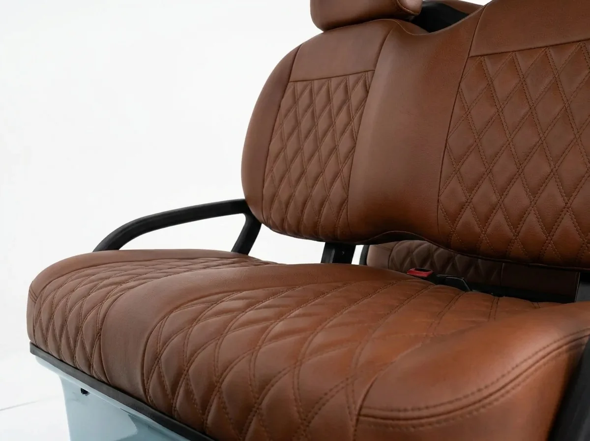 Brown diamond-stitched seats in a six-seat electric golf cart