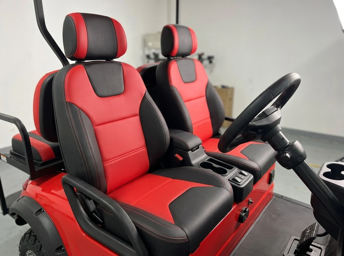 Red and black seat detail in a two-seat electric golf cart